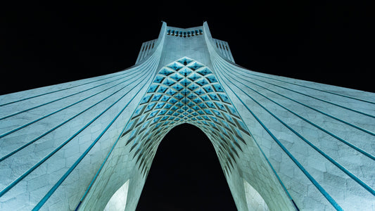Azadi Tower illuminated at night in Tehran, Iran