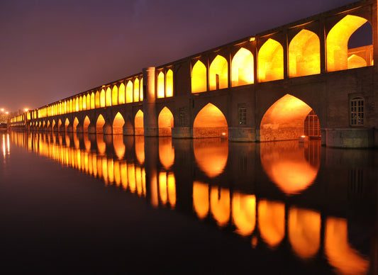 Si-o-se-pol and its illuminated arches over the Zayandeh River in Isfahan, Iran