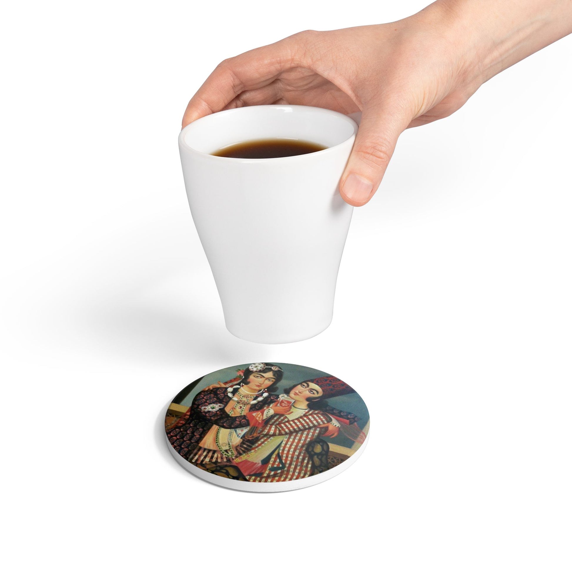Ceramic coaster with vintage design featuring two people, a hand holding a white mug with coffee.