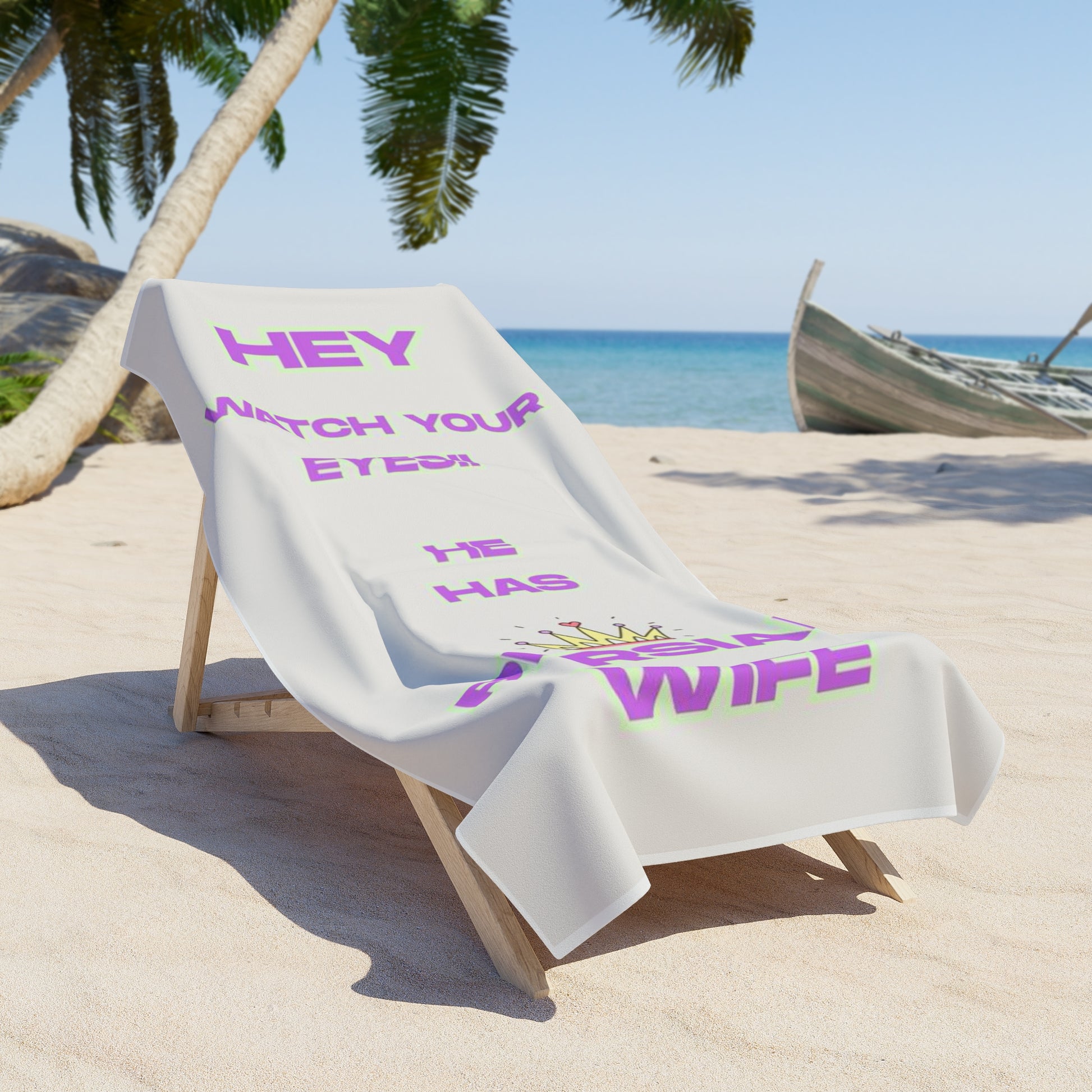 Beach towel with humorous text on a lounge chair at a tropical beach.