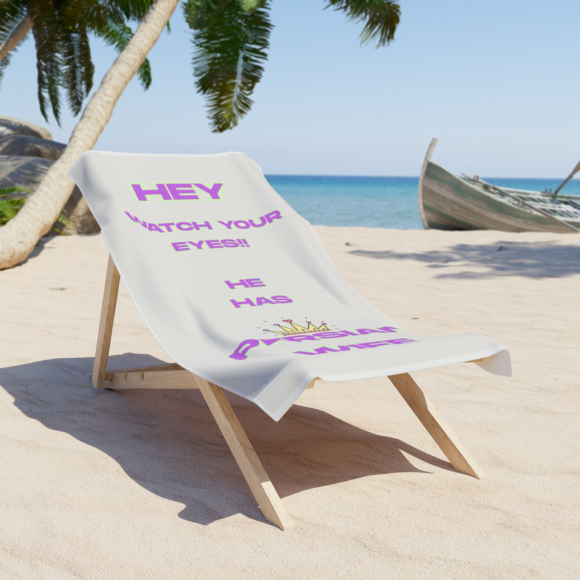 Beach towel with humorous text on a wooden chair at a tropical beach.